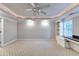 Finished basement room with ceiling fan, carpet, and built-in shelving at 3871 River Mansion Dr, Peachtree Corners, GA 30096