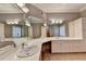 Elegant bathroom featuring a large vanity with ample counter space and storage at 3871 River Mansion Dr, Peachtree Corners, GA 30096