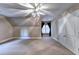 Spacious bedroom featuring carpet, natural light, a closet, and ceiling fan at 3871 River Mansion Dr, Peachtree Corners, GA 30096