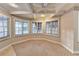 Bedroom with multiple windows, coffered ceiling with ceiling fan, and cozy carpet flooring at 3871 River Mansion Dr, Peachtree Corners, GA 30096