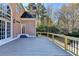 A spacious deck off the house offers views of the private wooded lot at 3871 River Mansion Dr, Peachtree Corners, GA 30096