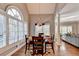 Elegant dining room featuring a vaulted ceiling, large windows, and a stylish chandelier at 3871 River Mansion Dr, Peachtree Corners, GA 30096