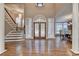 Elegant foyer with hardwood floors, staircase, and decorative glass windows at 3871 River Mansion Dr, Peachtree Corners, GA 30096