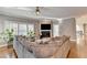 Living room featuring a fireplace, hardwood floors, plants, and an open concept at 3871 River Mansion Dr, Peachtree Corners, GA 30096