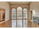 Bright living room with hardwood floors, fireplace, and large windows offering ample natural light at 3871 River Mansion Dr, Peachtree Corners, GA 30096