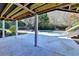 A covered patio overlooks the pool and expansive backyard area at 3871 River Mansion Dr, Peachtree Corners, GA 30096