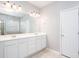 Bright bathroom with dual sinks and a large vanity with an oversized mirror at 500 Sapphire Valley Ln, Canton, GA 30114