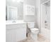 Bright bathroom with white vanity, toilet, and shower/tub combo at 500 Sapphire Valley Ln, Canton, GA 30114