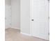 Neutral bedroom with a light beige carpet and a closet at 500 Sapphire Valley Ln, Canton, GA 30114