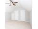 Neutral bedroom with a ceiling fan and 3 doors on one wall, and neutral carpet at 500 Sapphire Valley Ln, Canton, GA 30114