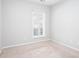 Neutral bedroom with a light beige carpet and a window with white blinds at 500 Sapphire Valley Ln, Canton, GA 30114