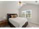 Bedroom featuring a ceiling fan and large window for natural light at 938 Burnt Hickory Nw Cir, Marietta, GA 30064