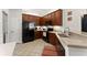 View of kitchen with dark cabinets and stainless steel appliances at 938 Burnt Hickory Nw Cir, Marietta, GA 30064