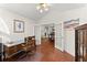 Bright office featuring hardwood floors, ceiling fan, and glass French doors leading to the dining area at 938 Burnt Hickory Nw Cir, Marietta, GA 30064