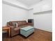Cozy basement living area with a leather sofa, ottoman, and a small table at 152 Park Dr, Decatur, GA 30030