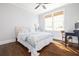 Bedroom features hardwood floors, a ceiling fan, natural light, and a work space for simple living at 152 Park Dr, Decatur, GA 30030