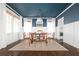 Dining room featuring a dark blue ceiling, white wainscoting, and neutral decor at 152 Park Dr, Decatur, GA 30030