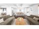 Bright open concept living space showcasing kitchen with stainless steel appliances and seating at island at 152 Park Dr, Decatur, GA 30030