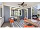 Covered patio with blue siding, a dining area, and comfortable seating, perfect for outdoor entertaining at 152 Park Dr, Decatur, GA 30030