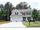 Charming two-story home with a well-manicured lawn and a two-car garage at 200 Stone Lake Dr, Dallas, GA 30157