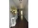 Long hallway featuring hardwood floors, neutral paint, and a decorative console table at 200 Stone Lake Dr, Dallas, GA 30157