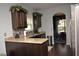 Modern kitchen featuring granite countertops, stainless steel appliances, and dark wood cabinets at 200 Stone Lake Dr, Dallas, GA 30157