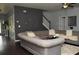 Cozy living room featuring a gray sofa, hardwood floors, and a unique wall clock at 200 Stone Lake Dr, Dallas, GA 30157