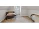 A cozy attic nook features a chair with natural light coming from the window at 4212 Lazy Creek Dr, Marietta, GA 30066