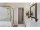 Bright bathroom featuring a shower, tub and modern vanity at 4212 Lazy Creek Dr, Marietta, GA 30066