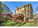 Backyard view of home featuring a spacious deck overlooking the landscaped yard at 4212 Lazy Creek Dr, Marietta, GA 30066