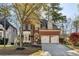 Charming red brick home featuring a two-car garage and well-maintained landscaping at 4212 Lazy Creek Dr, Marietta, GA 30066