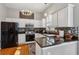 Stylish kitchen with white cabinets, stainless steel appliances, and breakfast bar at 4212 Lazy Creek Dr, Marietta, GA 30066