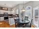 Eat-in kitchen featuring white cabinets, a breakfast nook, and plenty of natural light at 4212 Lazy Creek Dr, Marietta, GA 30066