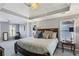 Spacious main bedroom suite with tray ceiling, chandelier and large windows at 4212 Lazy Creek Dr, Marietta, GA 30066
