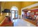 Grand foyer featuring tile flooring, an arched entryway, and an adjacent formal dining room at 6610 Sunbriar Dr, Cumming, GA 30040