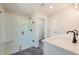 Bright bathroom with white vanity, glass shower, and sleek black fixtures at 163 Bluffington Way, Marietta, GA 30066
