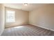 Cozy bedroom with plush carpeting and a bright window at 163 Bluffington Way, Marietta, GA 30066