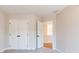 Bright bedroom with carpet flooring, closet, and neutral paint at 163 Bluffington Way, Marietta, GA 30066