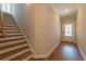 Hallway with stairs and a white door at 163 Bluffington Way, Marietta, GA 30066