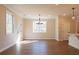Bright and airy living room featuring wood floors, white walls, recessed lighting, and large windows at 163 Bluffington Way, Marietta, GA 30066