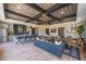 Stylish entertainment space with a modern kitchen, multiple seating areas, and unique ceiling features at 188 Balsam Dr, Dallas, GA 30157