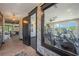 Modern gym area with brick accents and an open-concept design that features treadmills and exercise bikes at 188 Balsam Dr, Dallas, GA 30157