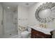 Bathroom featuring a glass door shower, marble countertop, and decorative mirror at 3636 Habersham Nw Rd # 2208, Atlanta, GA 30305