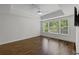 Bright bedroom featuring hardwood floors, a ceiling fan, recessed lights and many windows at 3636 Habersham Nw Rd # 2208, Atlanta, GA 30305