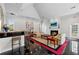 Clubhouse featuring a fireplace, sitting area, a bar with stools and glossy flooring at 3636 Habersham Nw Rd # 2208, Atlanta, GA 30305