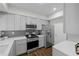 Modern kitchen with gray cabinets, stainless steel appliances, and sleek countertops at 3636 Habersham Nw Rd # 2208, Atlanta, GA 30305