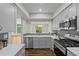 Modern kitchen with gray cabinets, stainless steel appliances, and backsplash at 3636 Habersham Nw Rd # 2208, Atlanta, GA 30305