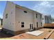 Back exterior view of a home with siding, a patio, and a brick foundation at 4300 Easter Lily Ave Lot 11, Buford, GA 30519