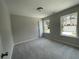 Cozy bedroom features plush carpeting, ample natural light from windows, and neutral decor at 4300 Easter Lily Ave Lot 11, Buford, GA 30519