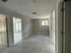 Comfortable bedroom features neutral carpet, with two doors and a window for natural light at 4300 Easter Lily Ave Lot 11, Buford, GA 30519